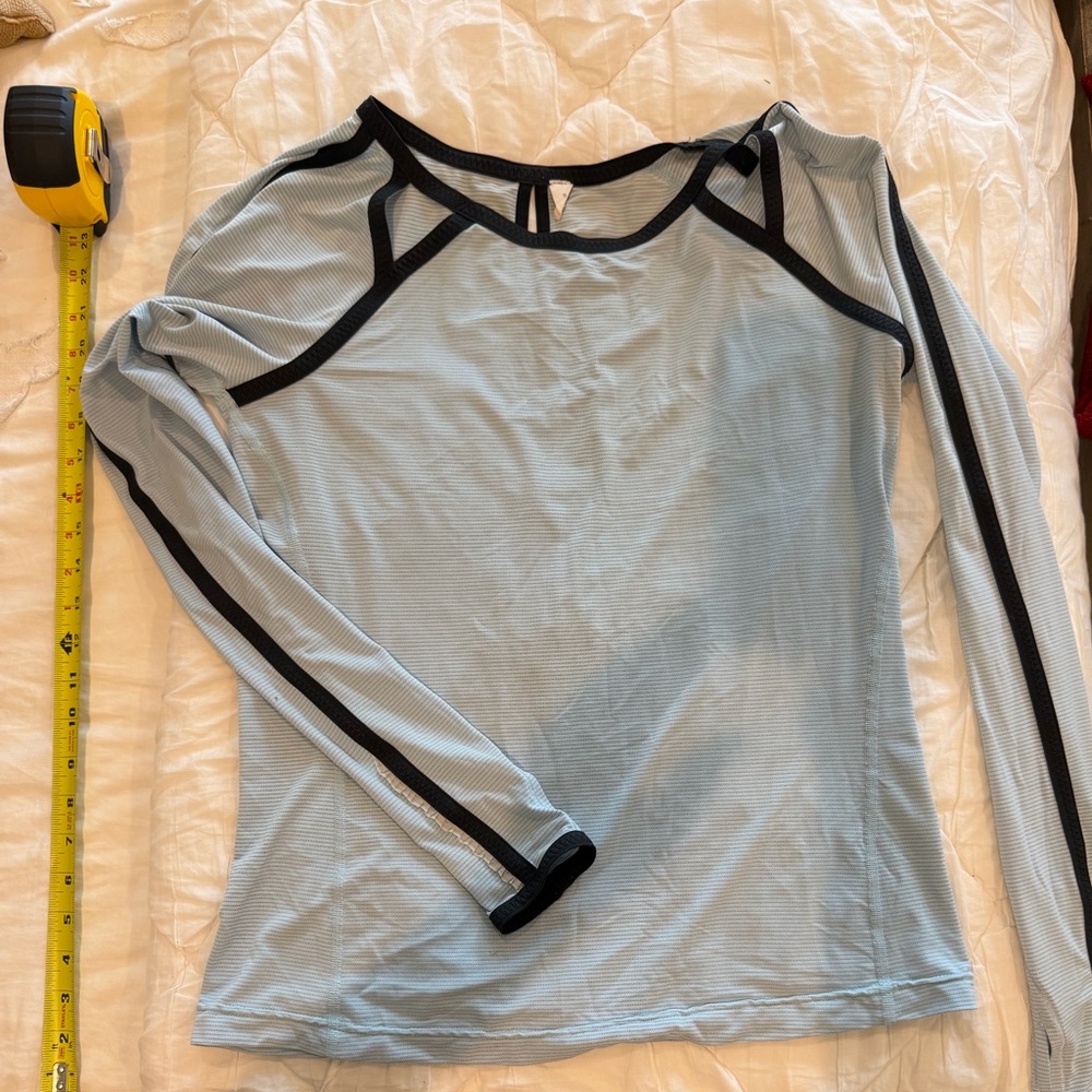 Lululemon Women's Light Blue Long Sleeve Top, with peak holes in back, sz 8